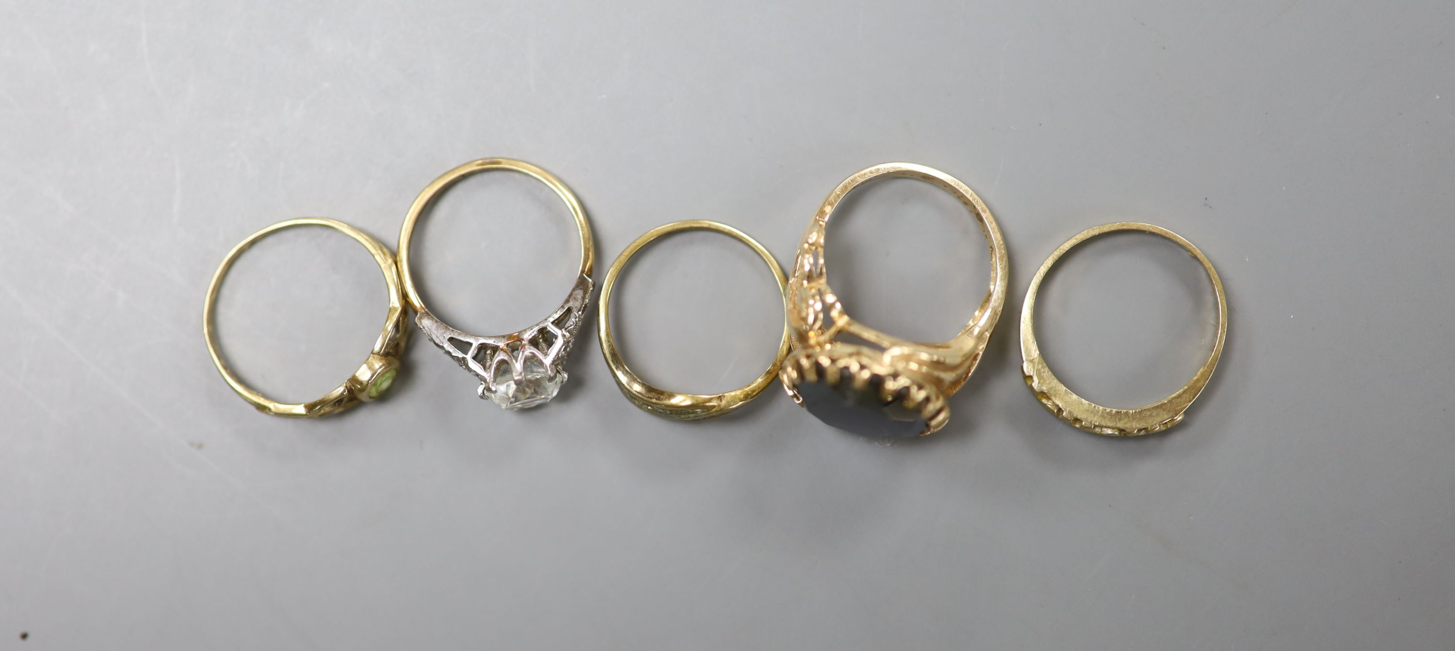 Five assorted modern 9ct gold and gem set dress rings including white zircon